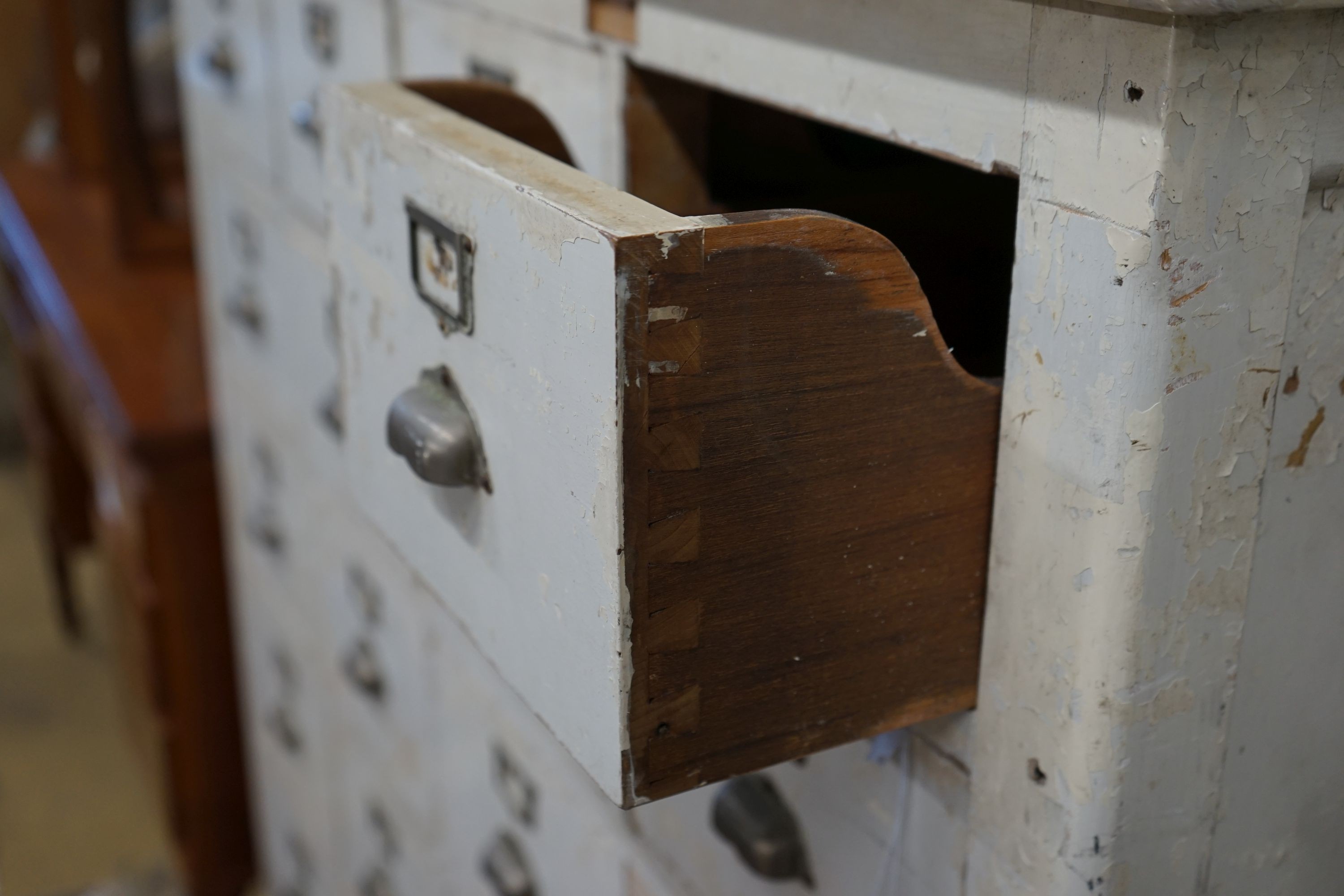 An early 20th century painted beech filing cabinet (lacking two drawers), width 114cm, depth 52cm, height 132cm